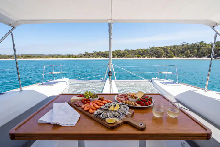 A seafood and grazing platter laid out on the deck table of Discover, anchored on Jervis Bay